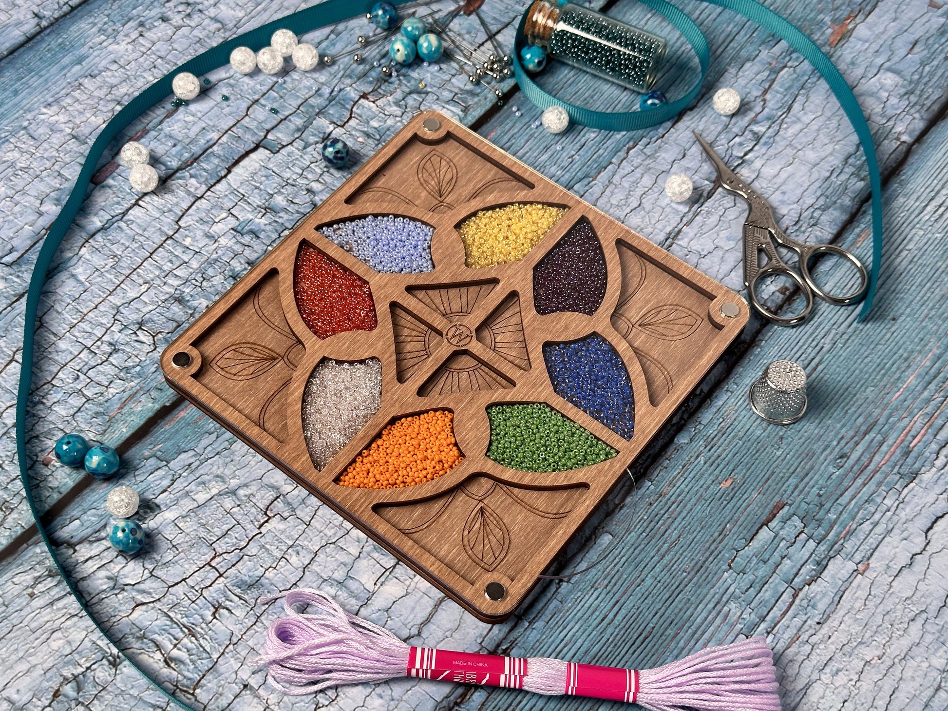 a wooden box with a flower design on it