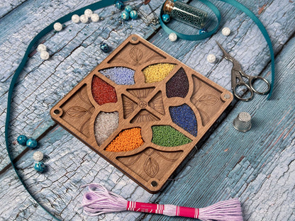 a wooden box with a flower design on it