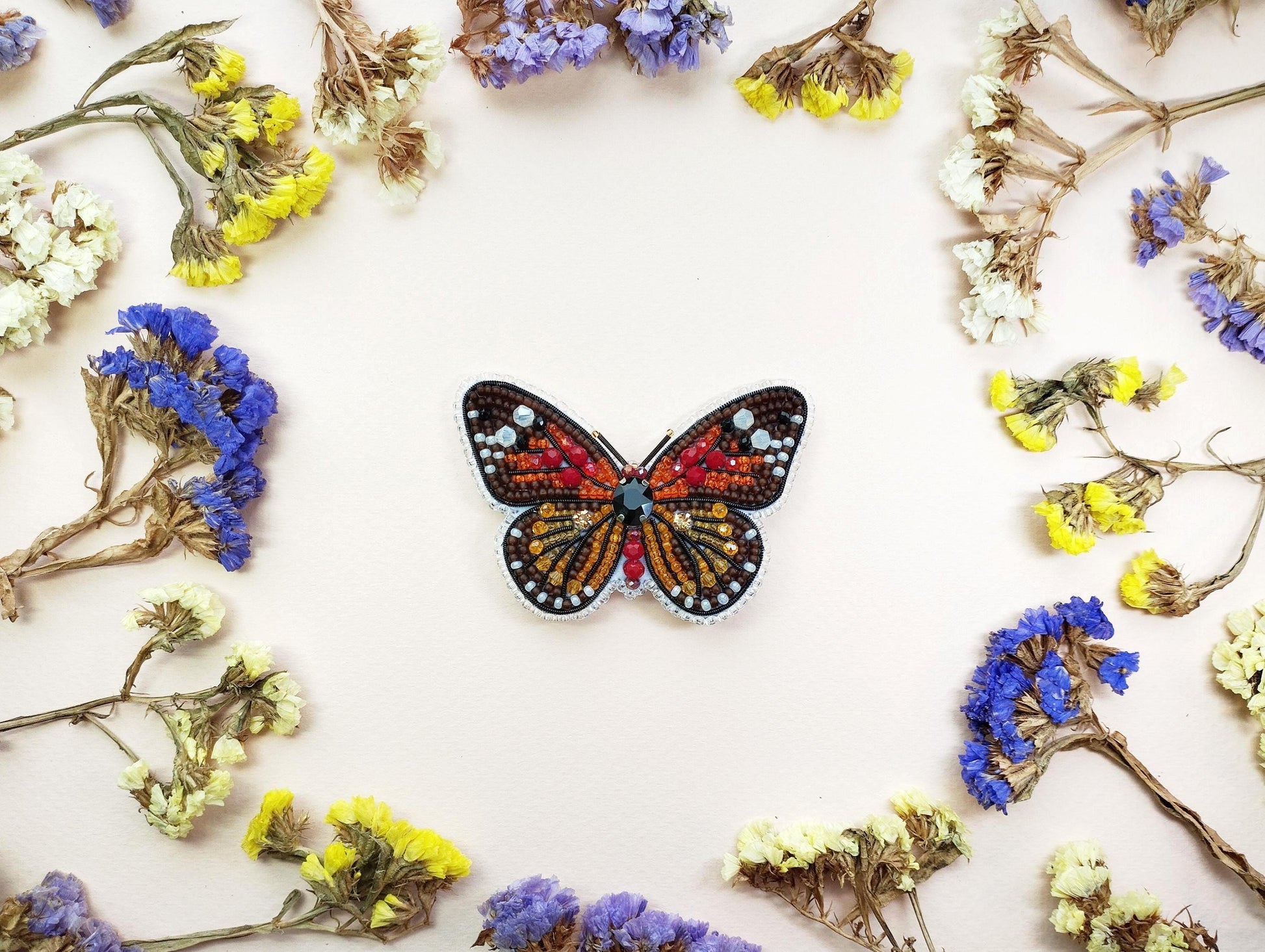 a picture of a butterfly surrounded by flowers