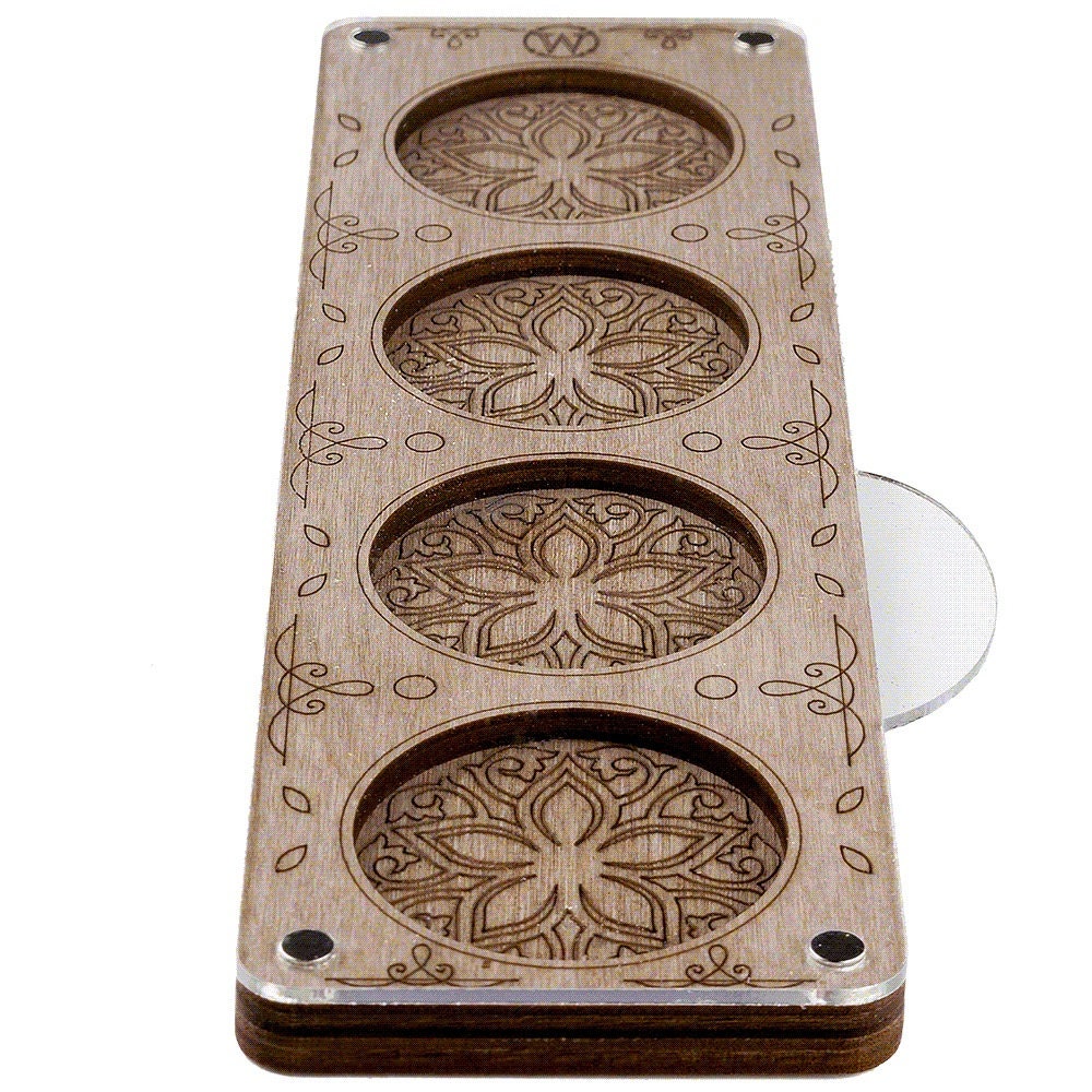 a wooden object with three holes in it