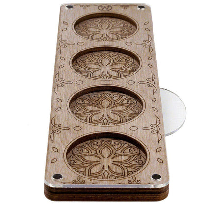 a wooden object with three holes in it