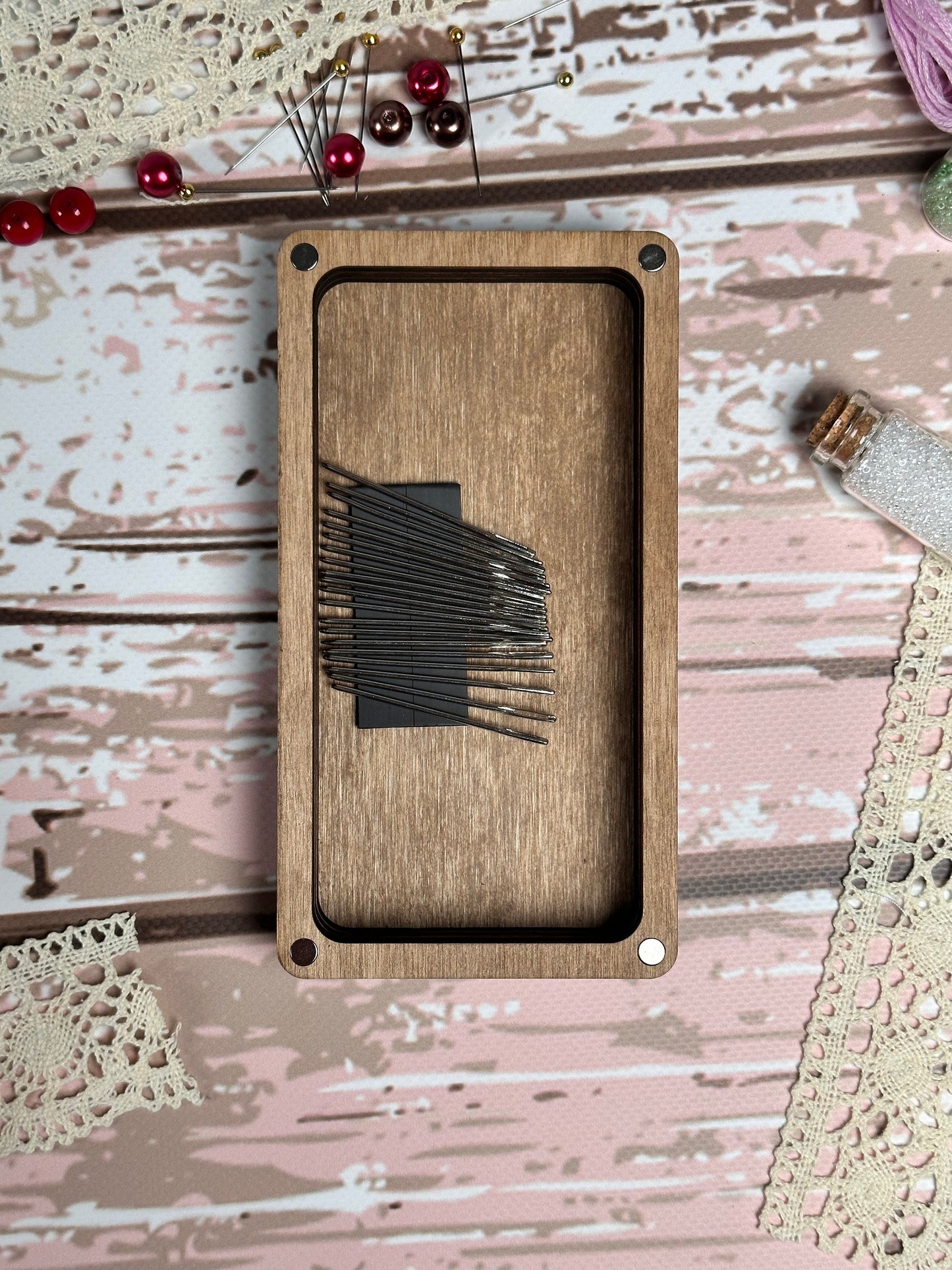 a wooden frame with a picture of a pair of scissors on it