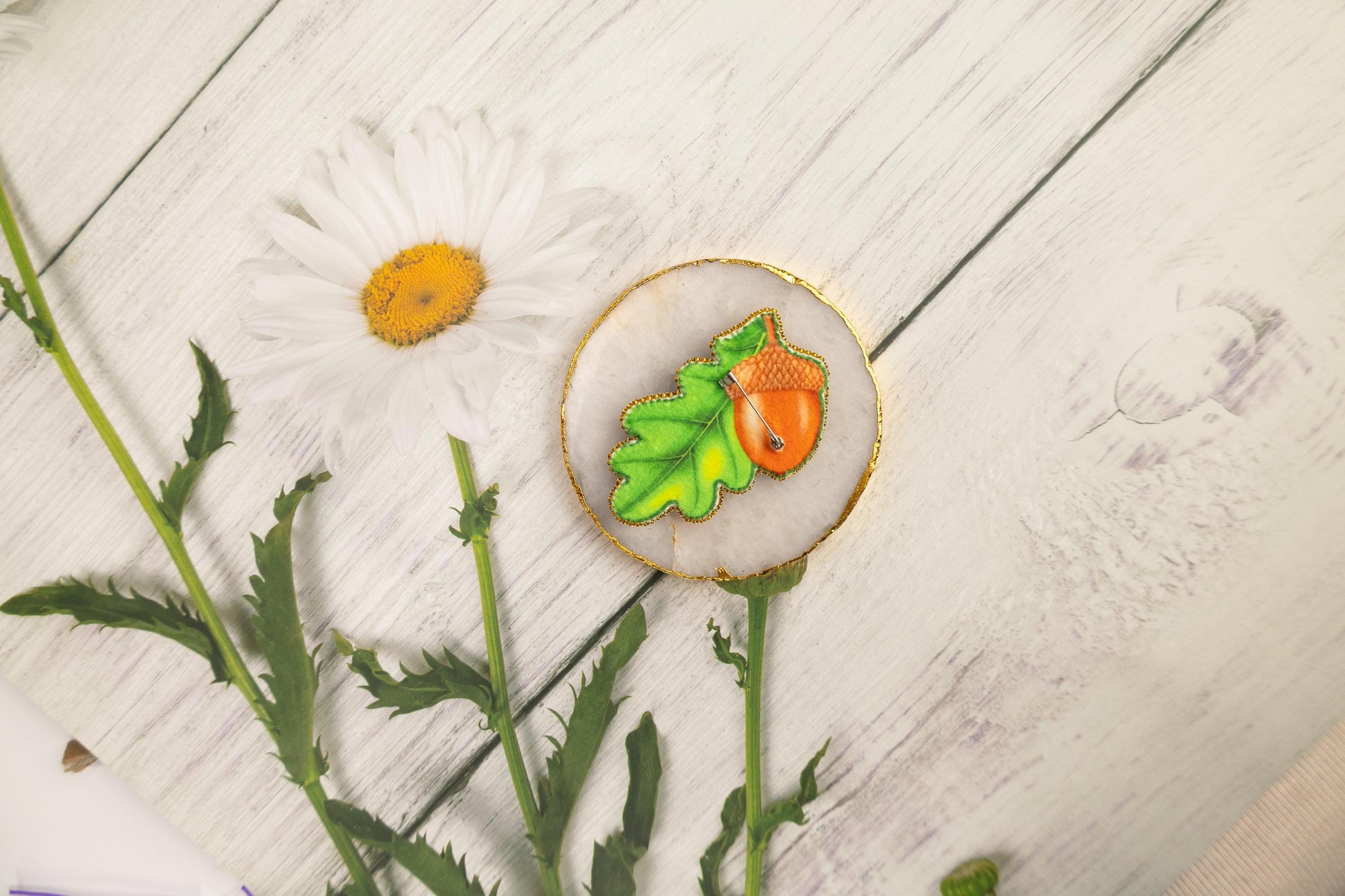 a flower and a cookie sitting on a table