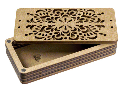 a wooden box with a laser cut design
