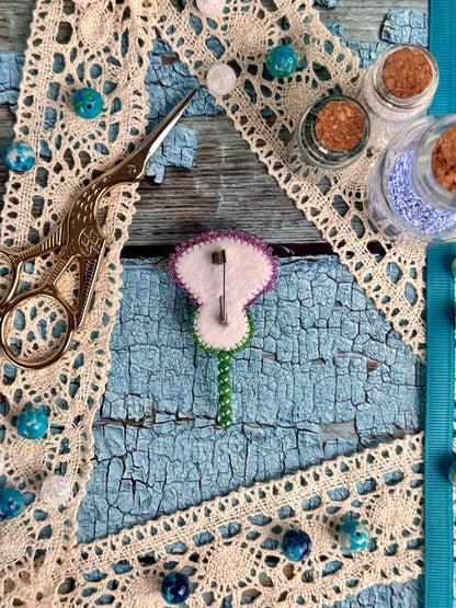 a picture of a piece of art with a clock on it