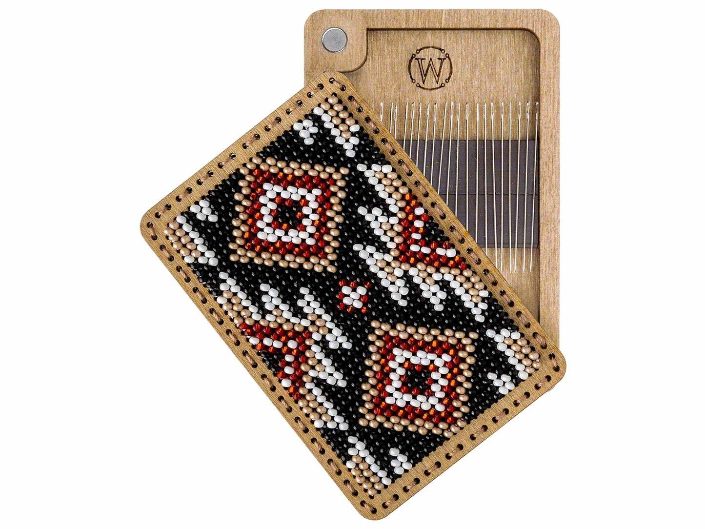 a wooden comb with a beaded design on it
