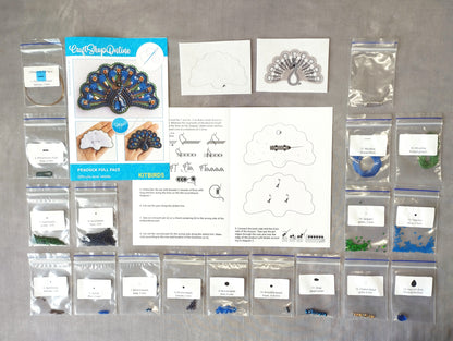 various craft supplies, including a peacock feather kit, beads, and instructions for creating a peacock-themed project.