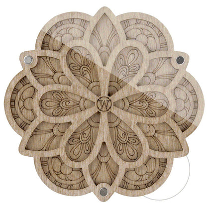 a wooden cutout of a flower on a white background