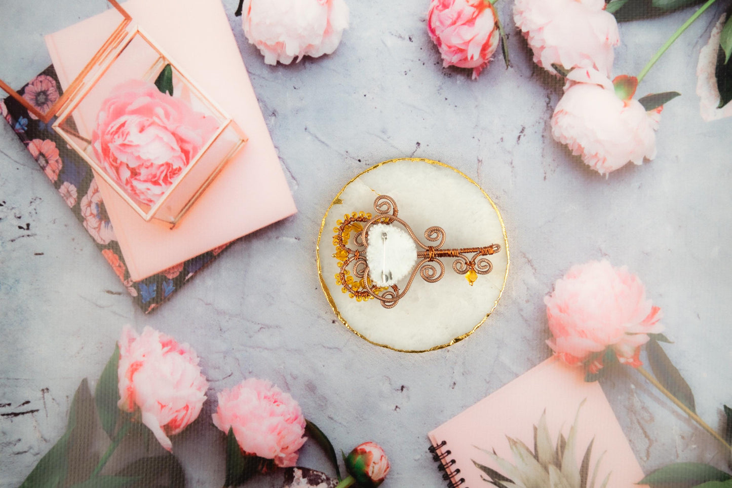 a cake with a key on top of it surrounded by flowers