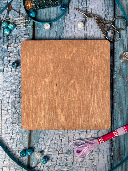 a wooden cutting board sitting on top of a table