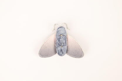 a pair of shoes hanging from the side of a wall