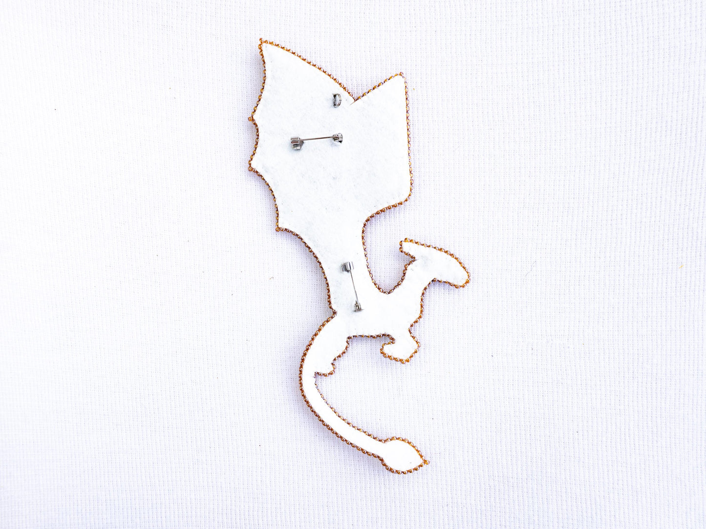 a close up of a metal object on a white surface