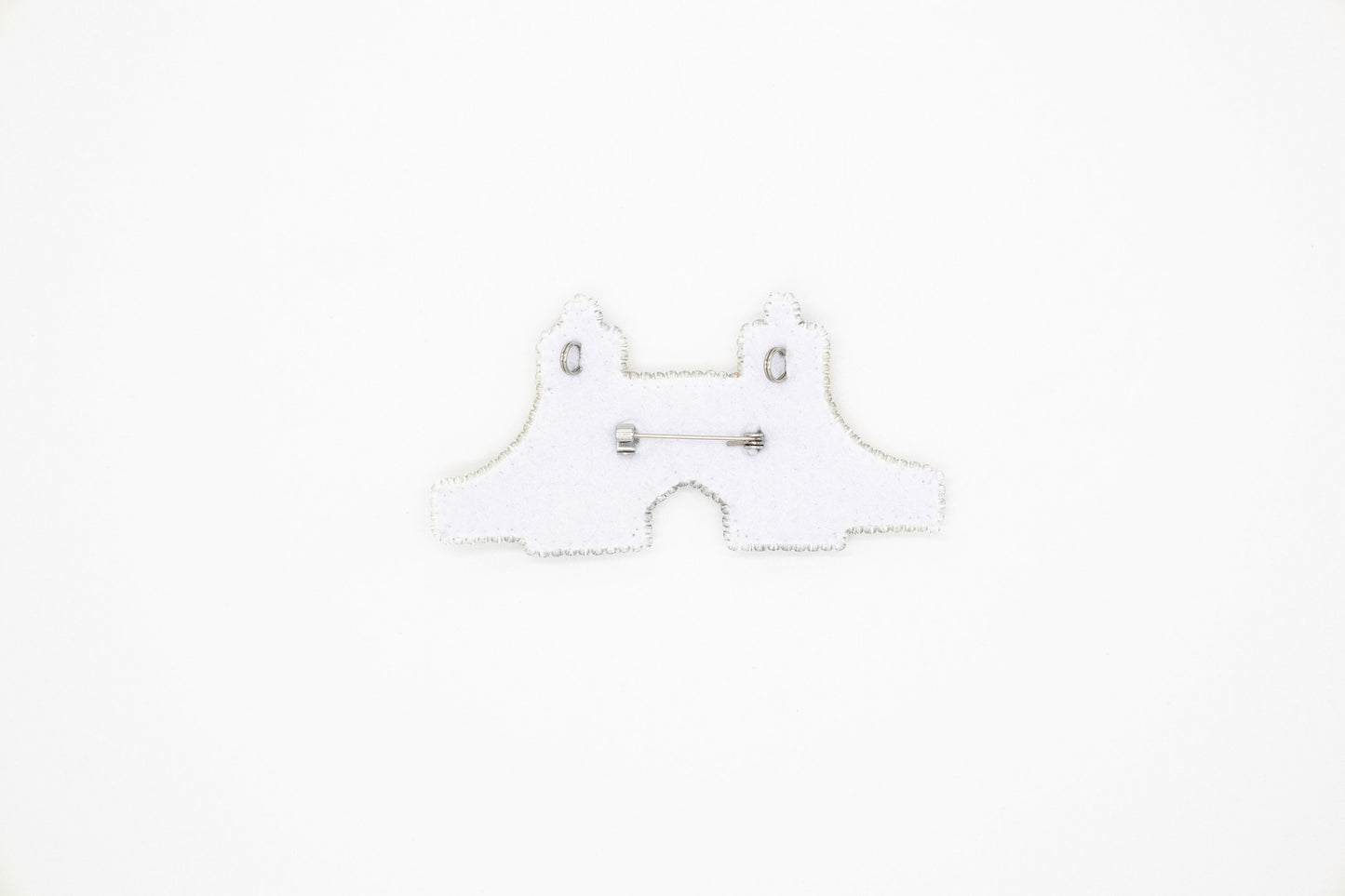 a white piece of paper with a pair of scissors on it