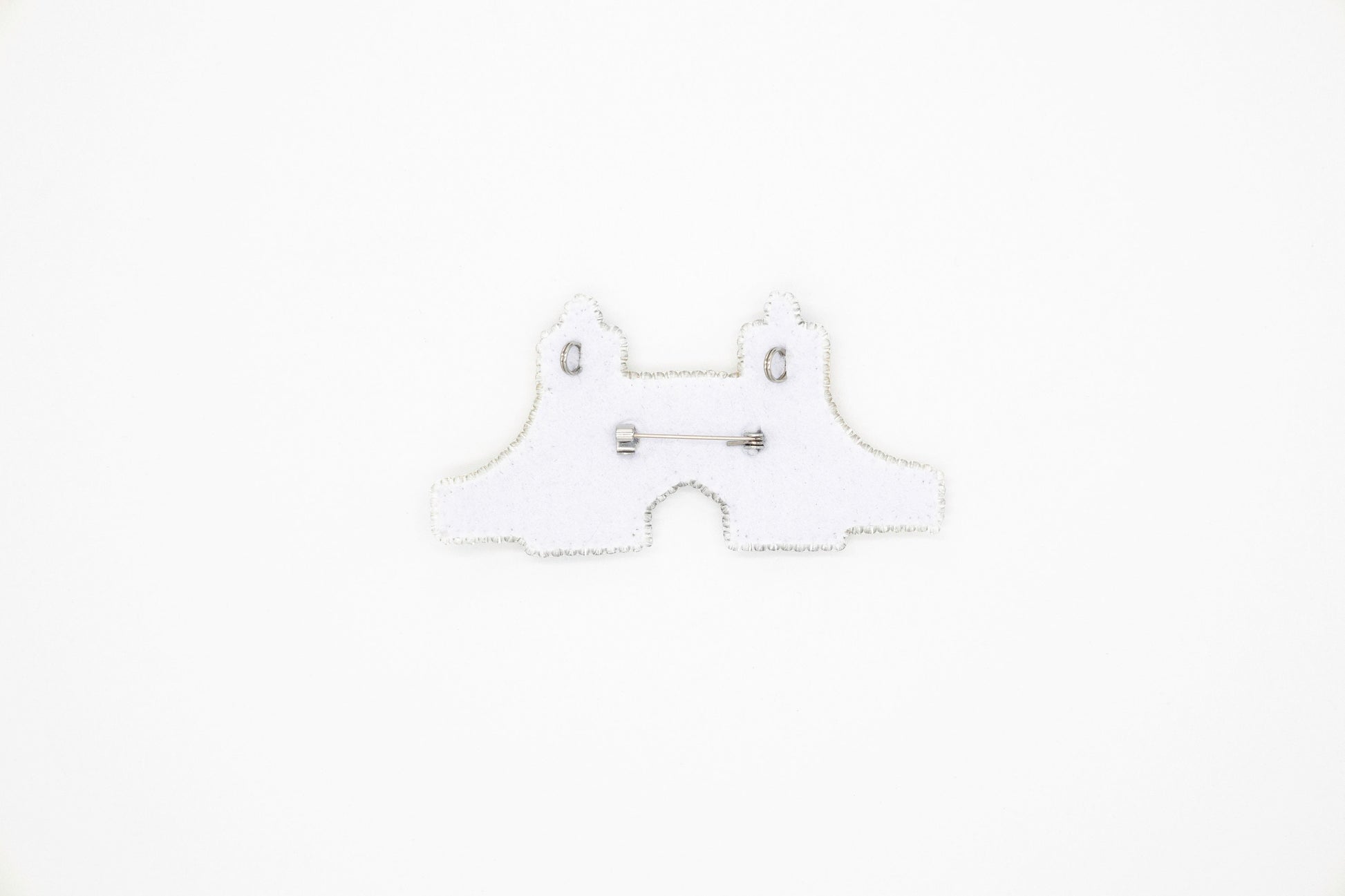 a white piece of paper with a pair of scissors on it