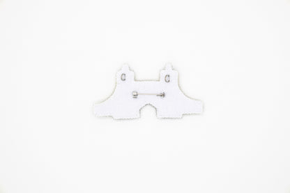 a white piece of paper with a pair of scissors on it