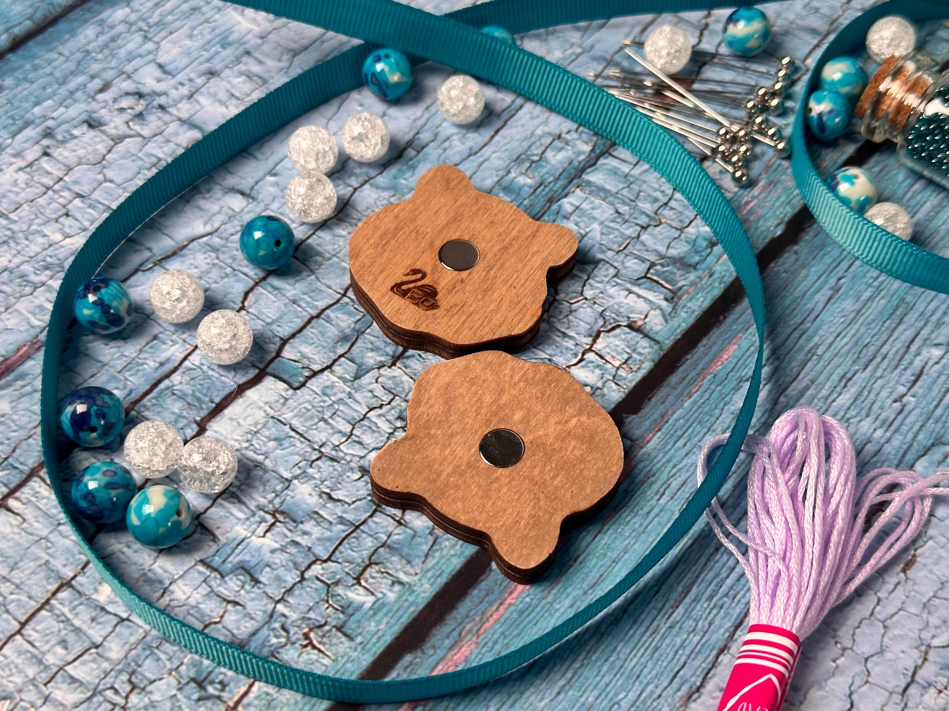 a pair of wooden buttons sitting on top of a table
