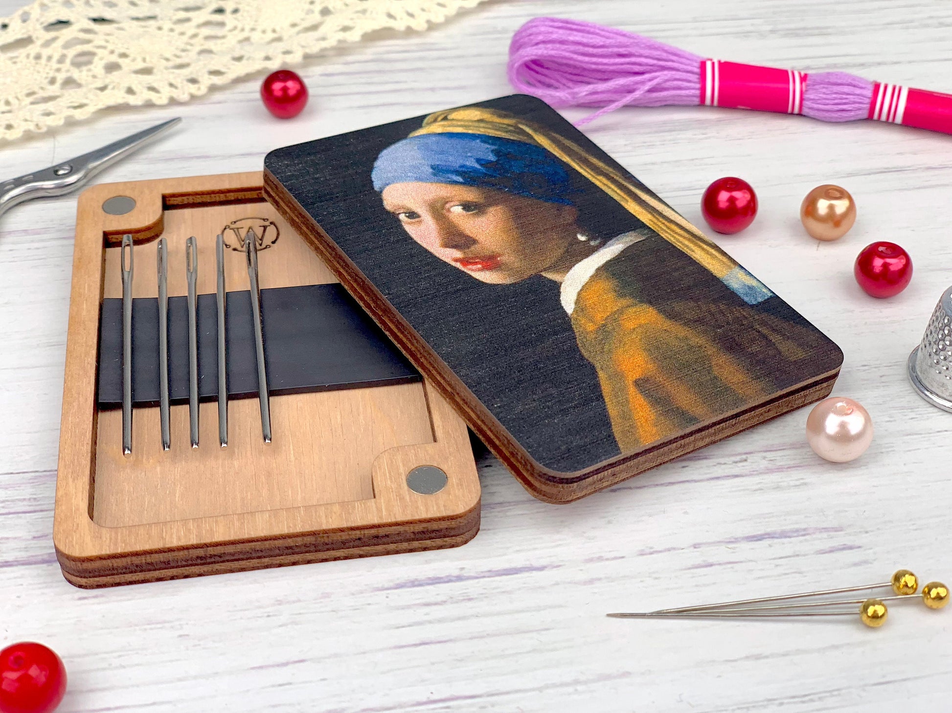 a wooden box with a picture of a girl with a pearl earring