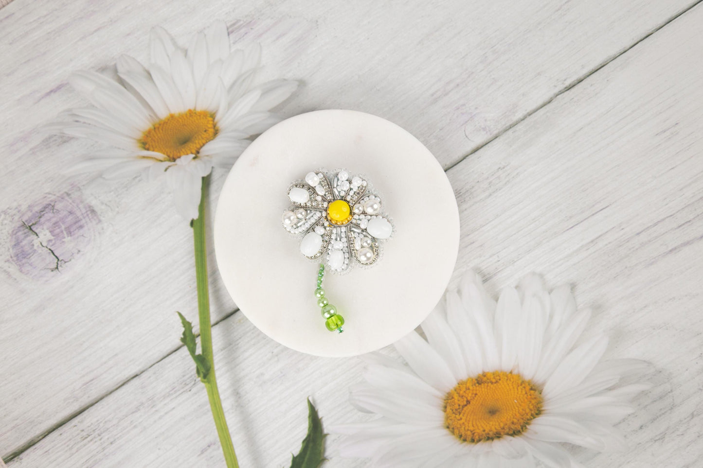 a white plate with a flower on top of it