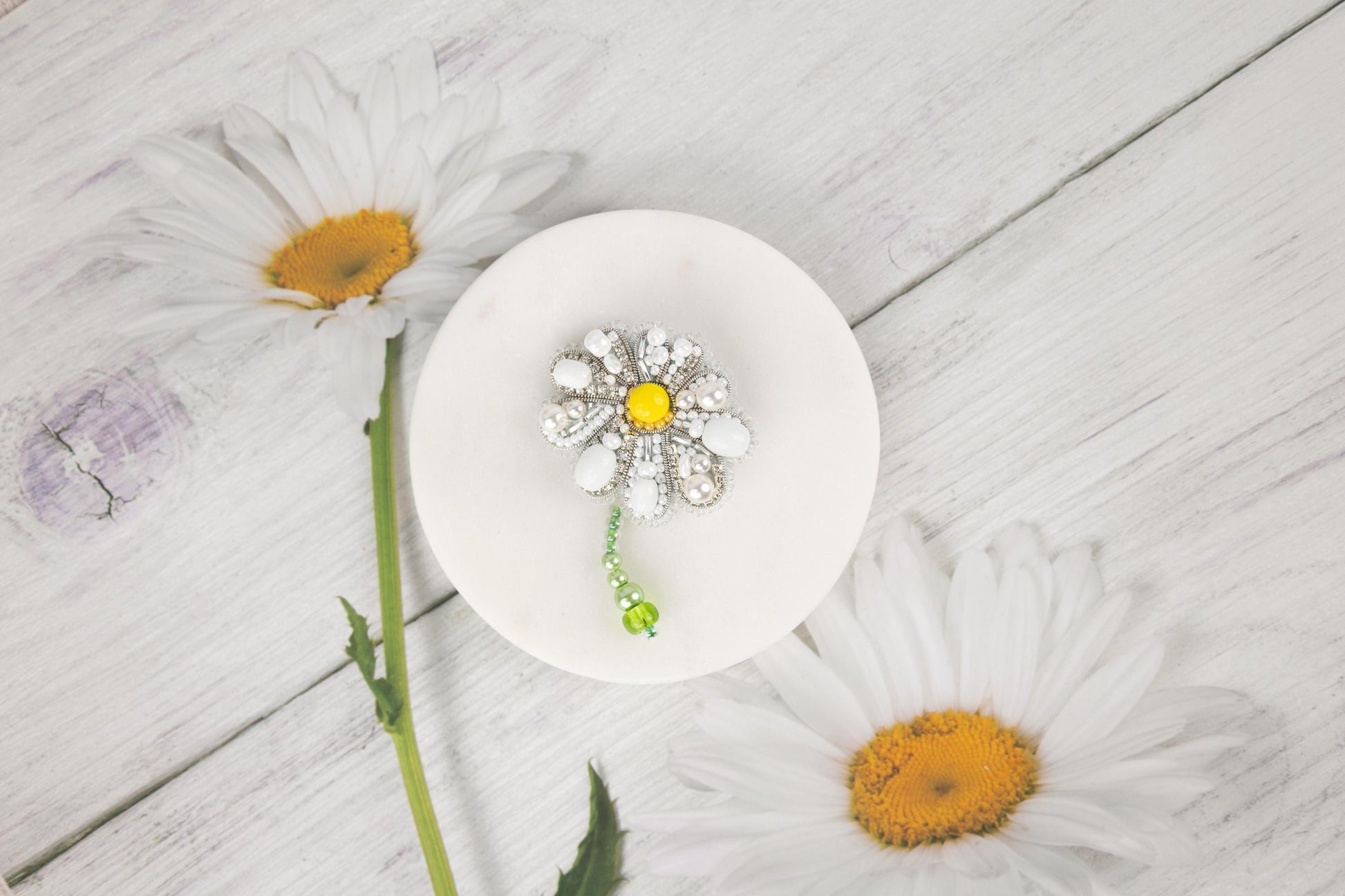a white plate with a flower on top of it