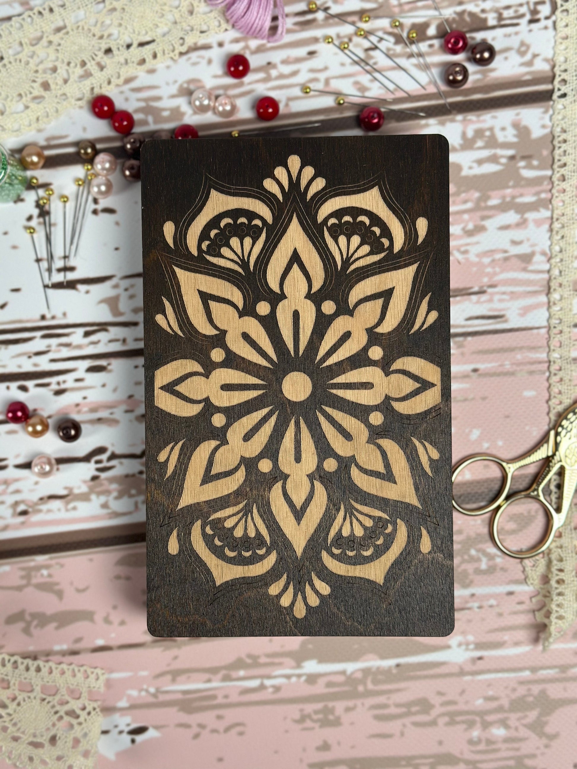 a wooden cutting board with a design on it