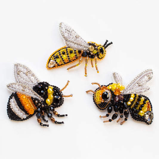 three beaded bees sitting on top of each other