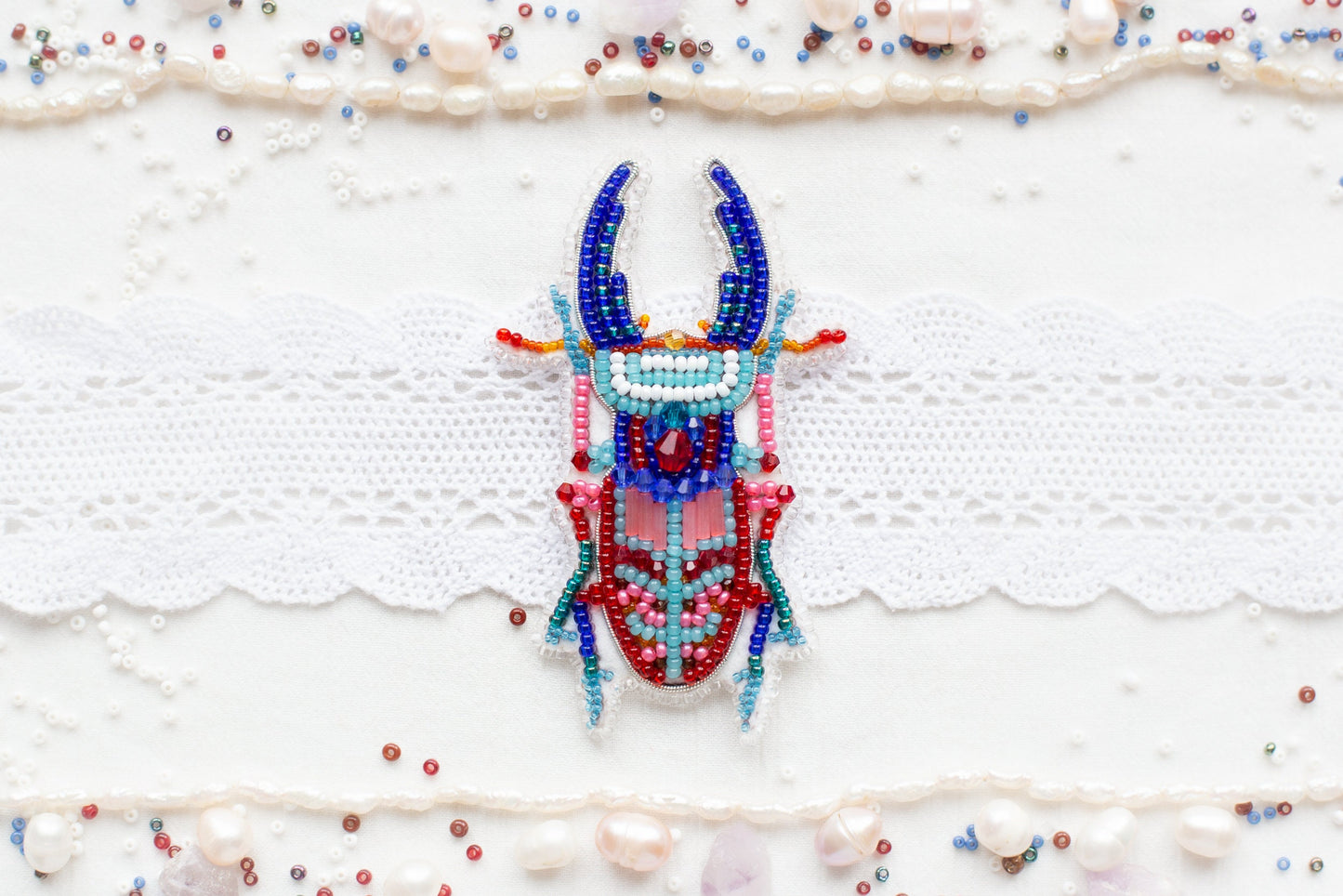 a beaded deer head on a white background