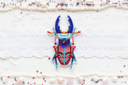 a beaded deer head on a white background