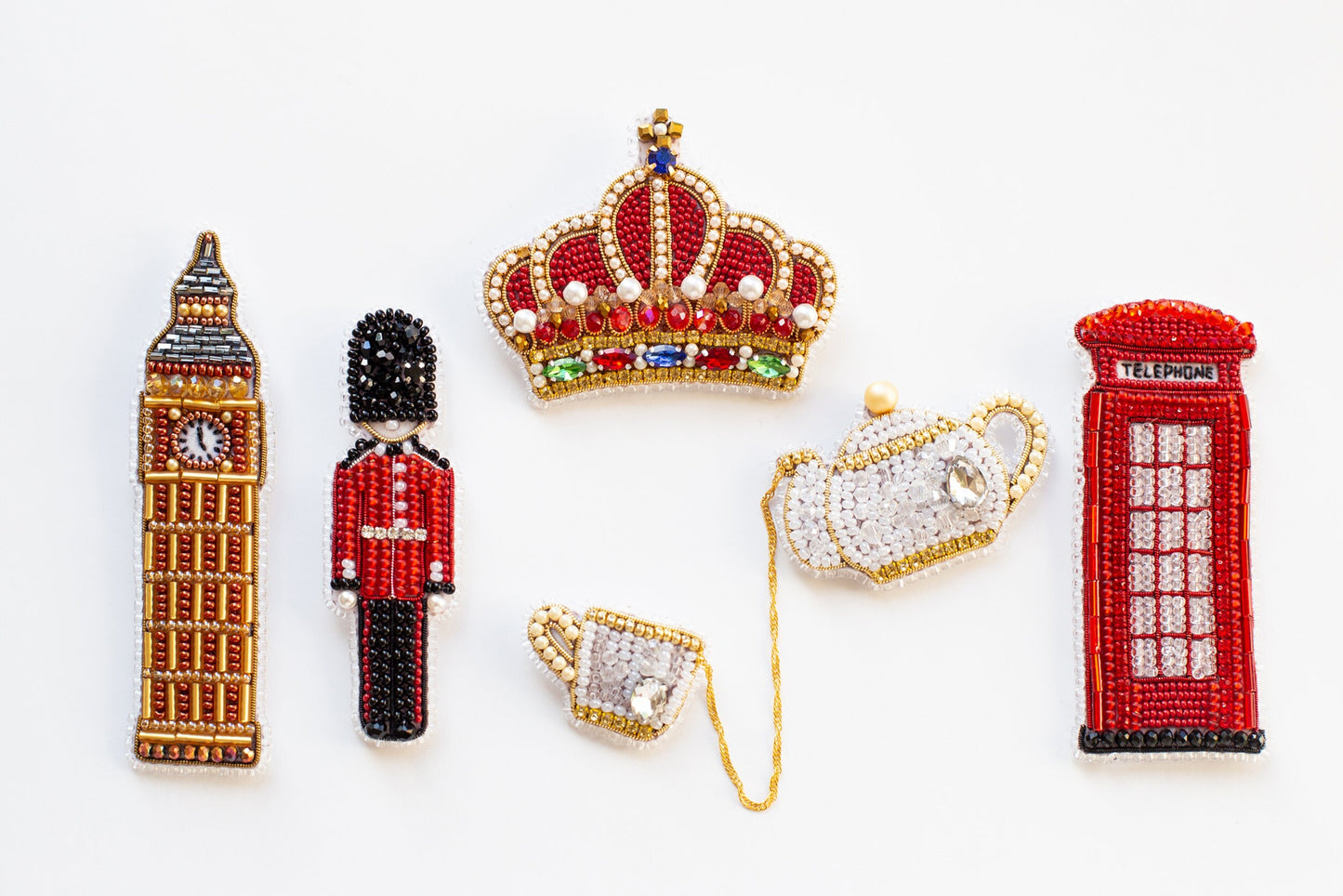 a collection of beaded objects including a phone, a british flag, and a