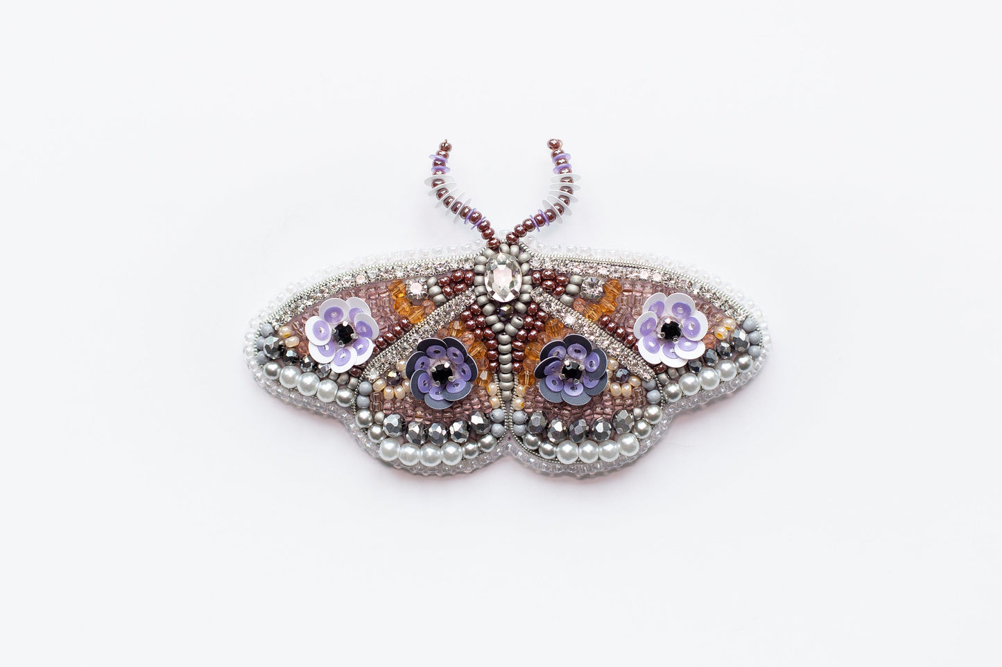 a close up of a butterfly on a white surface