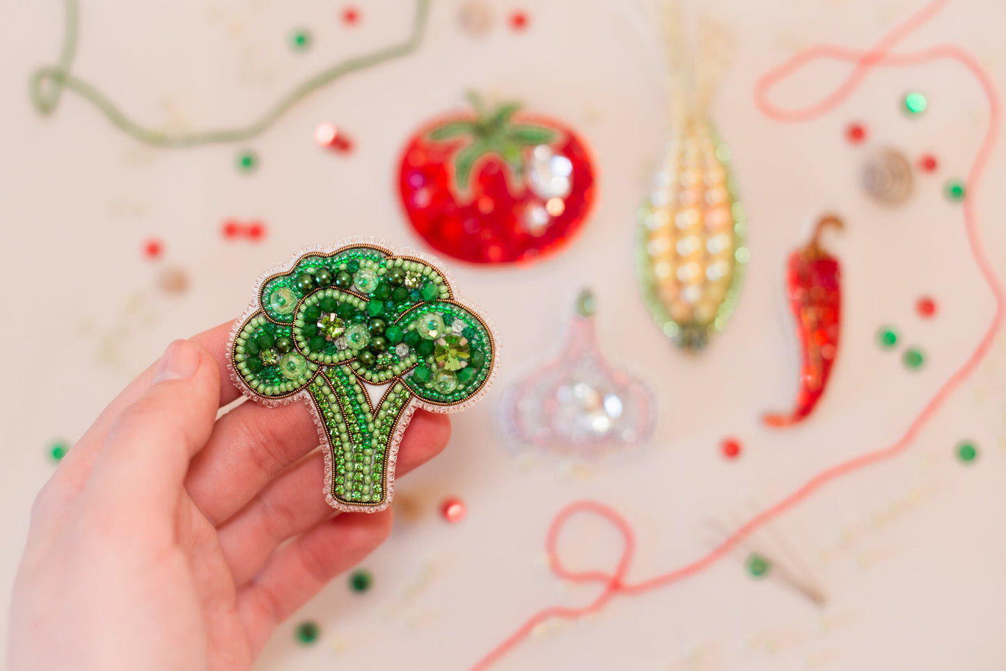 a person holding a brooch in their hand