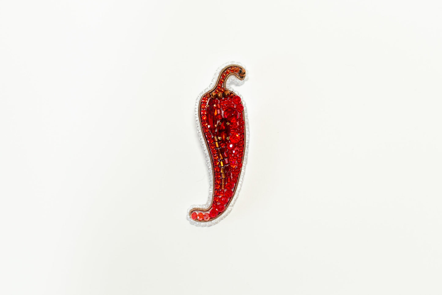 a sticker of a red chili on a white background