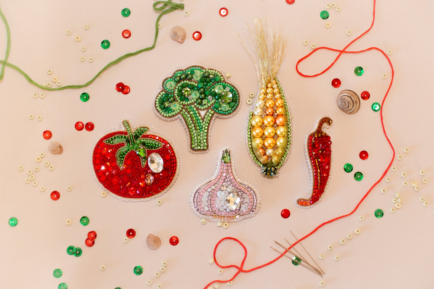 a group of beaded vegetables sitting on top of a table