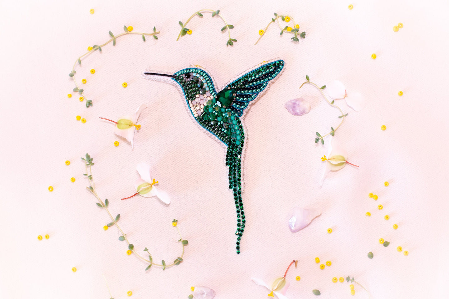 a picture of a hummingbird made out of beads