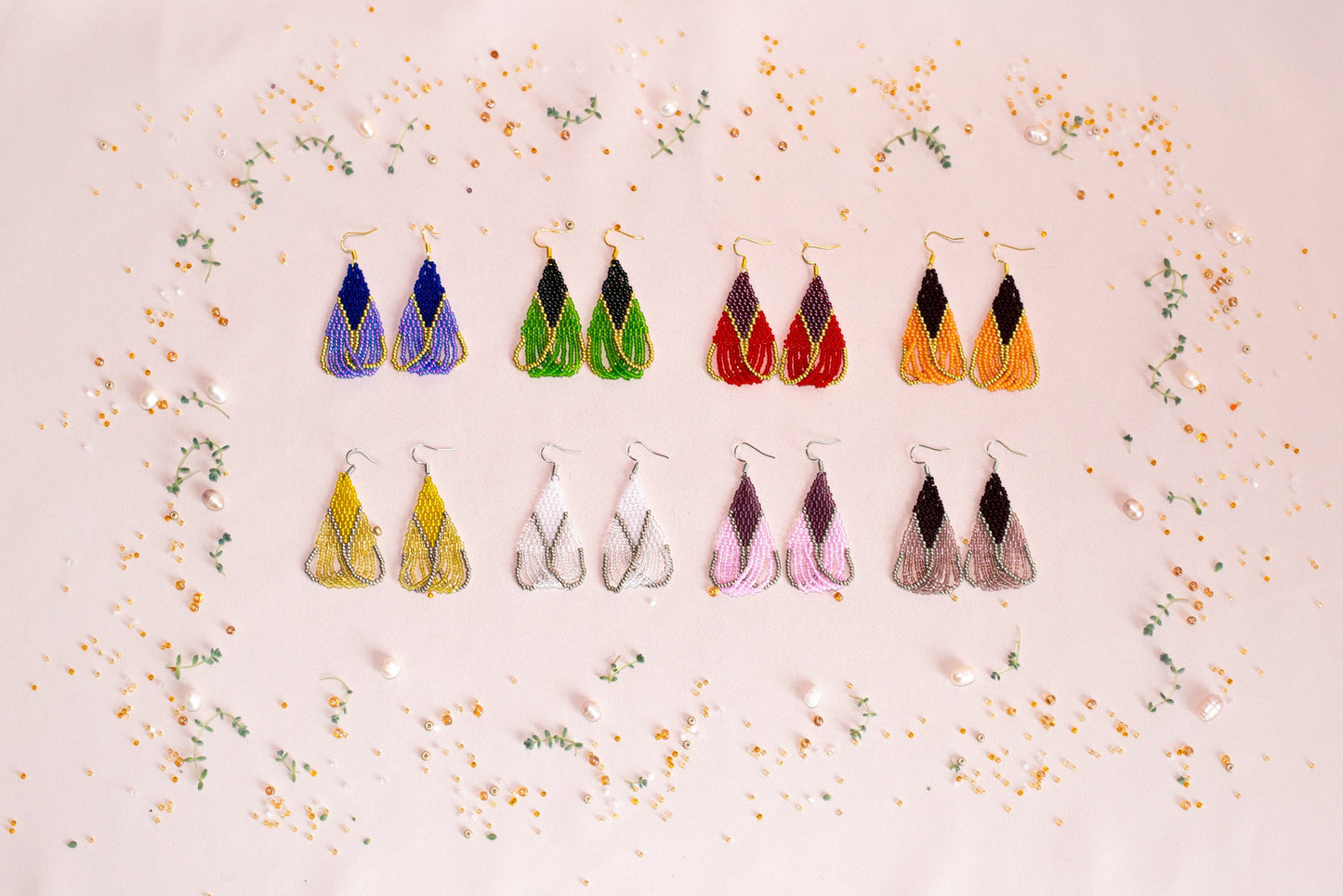 a group of pairs of earrings sitting on top of a table