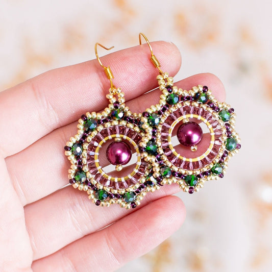 a pair of earrings on a tree branch