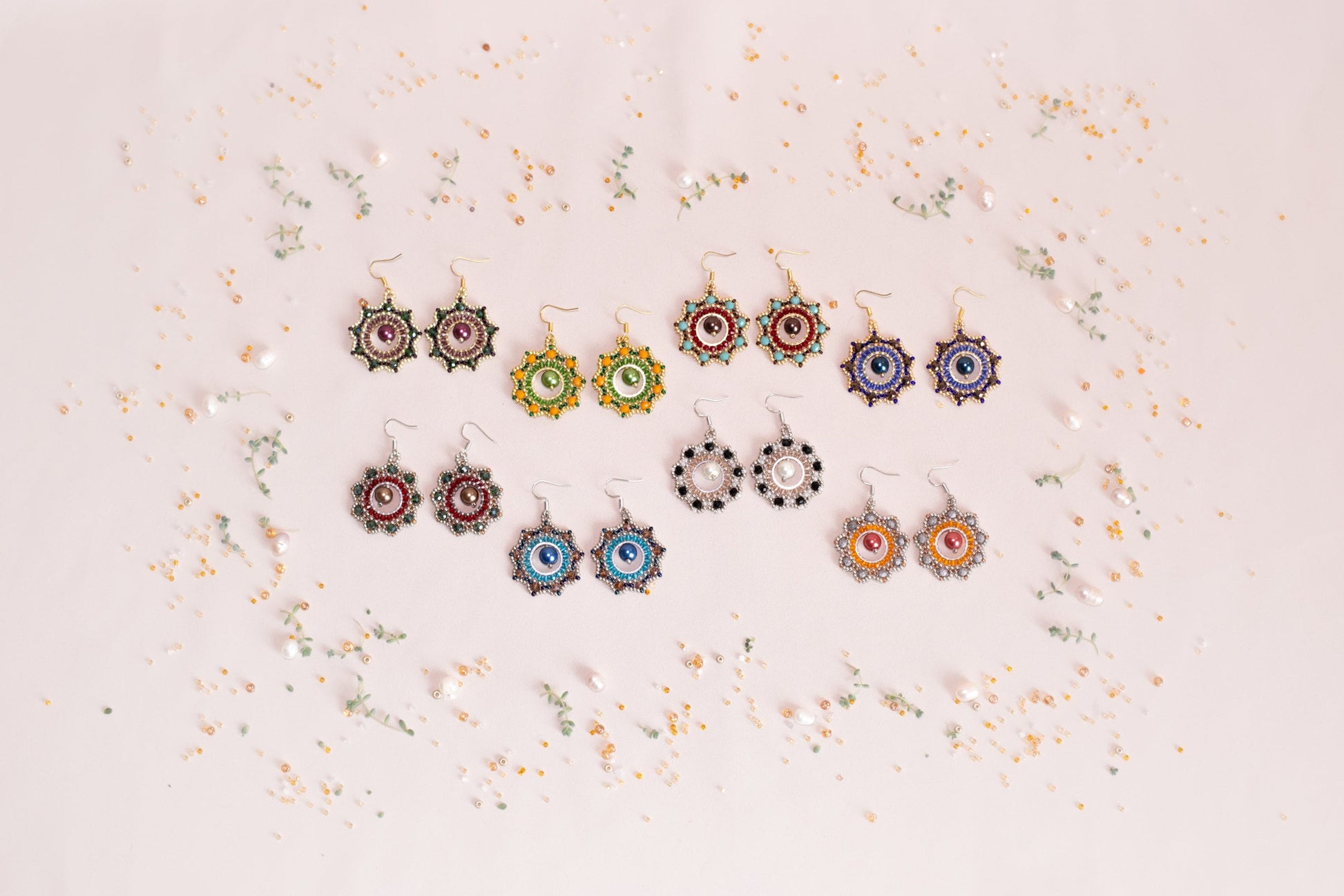 a group of earrings sitting on top of a table