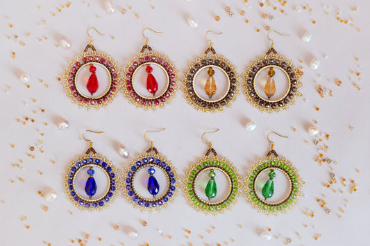 a set of six pairs of earrings on a table