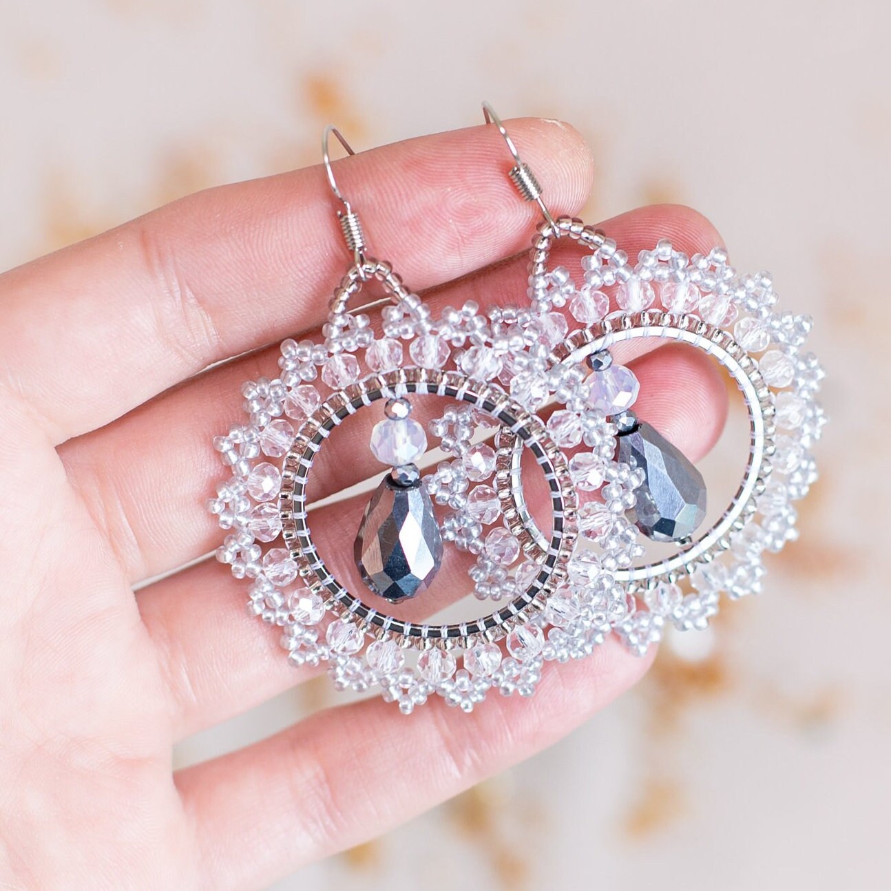 a pair of earrings sitting on top of a table