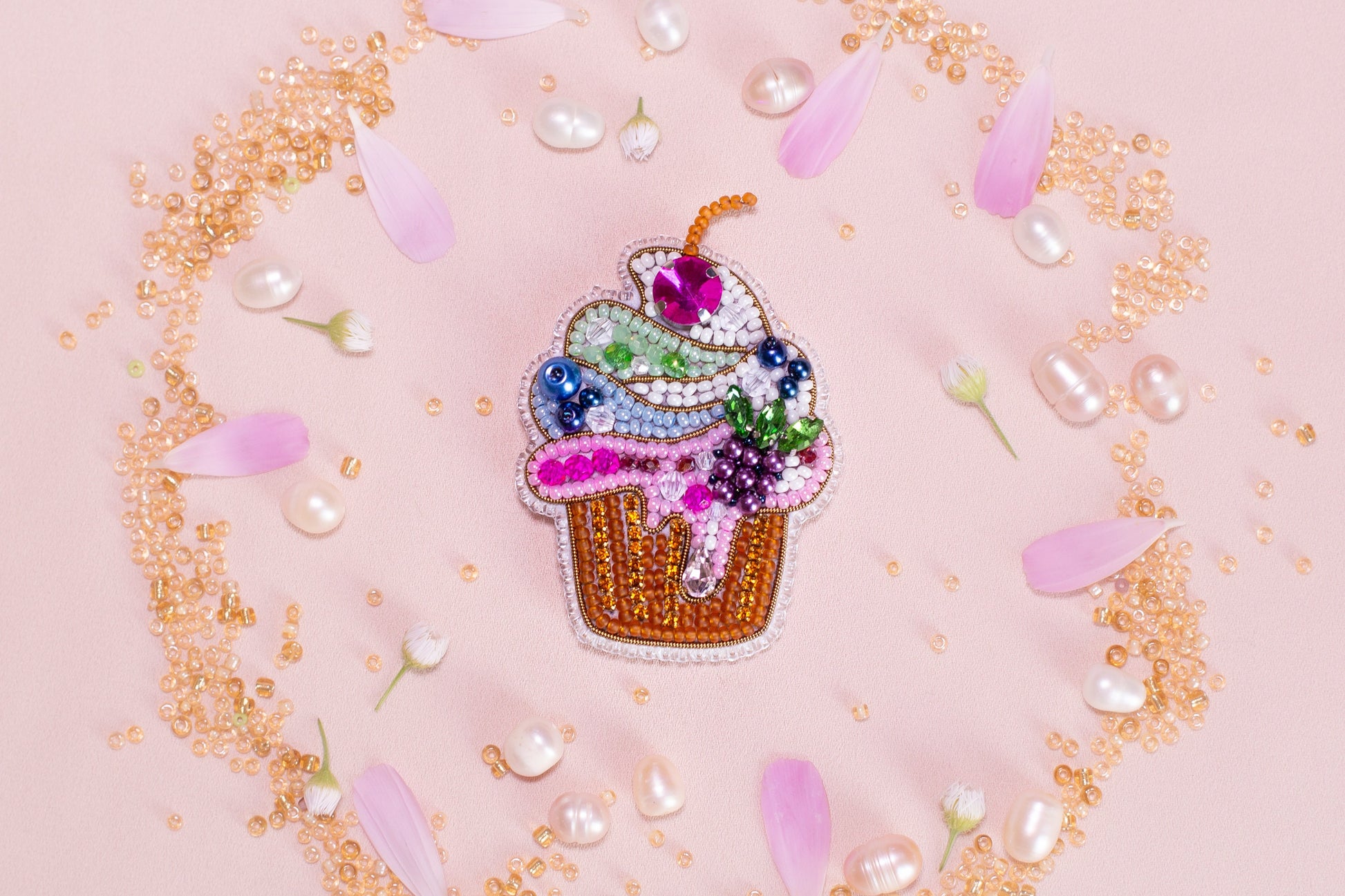 a pin with a cupcake on top of it