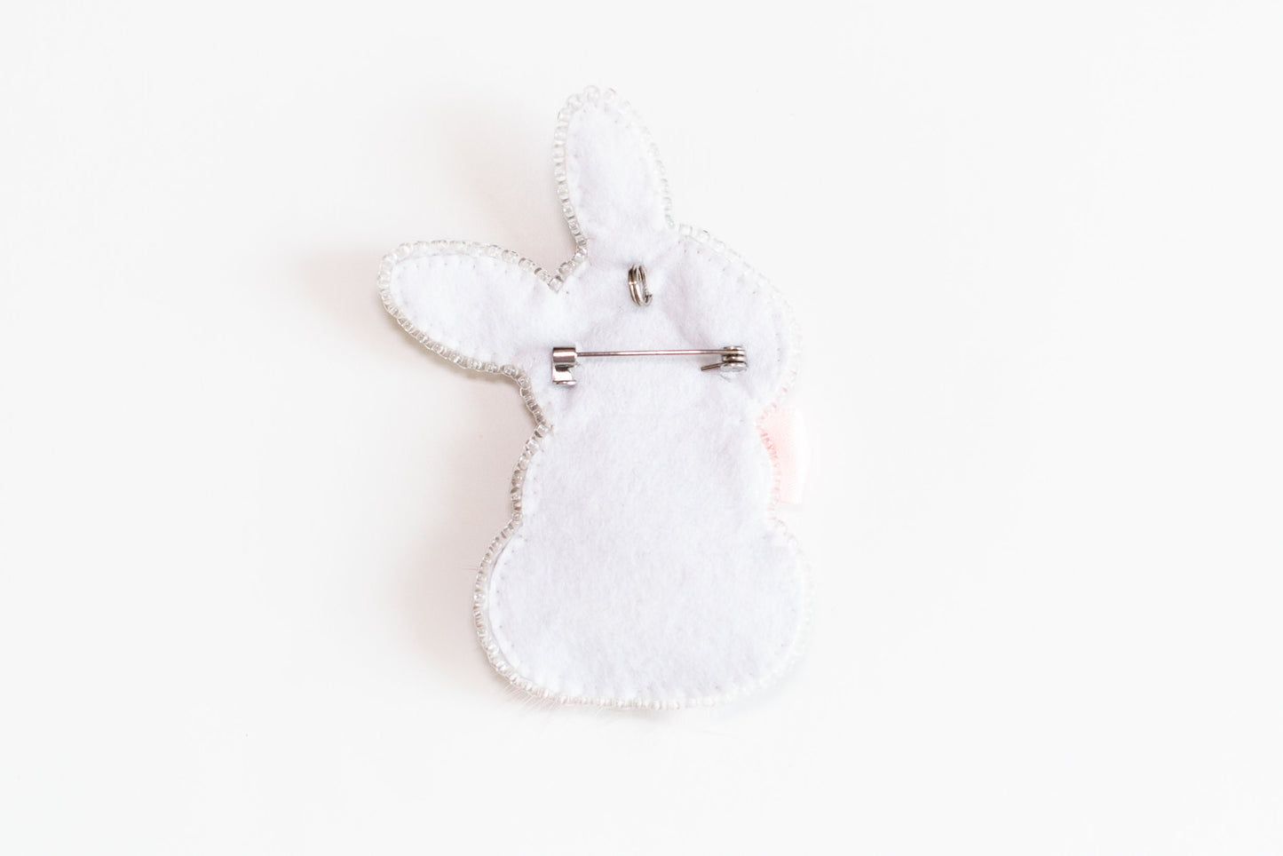 a white rabbit shaped object on a white surface