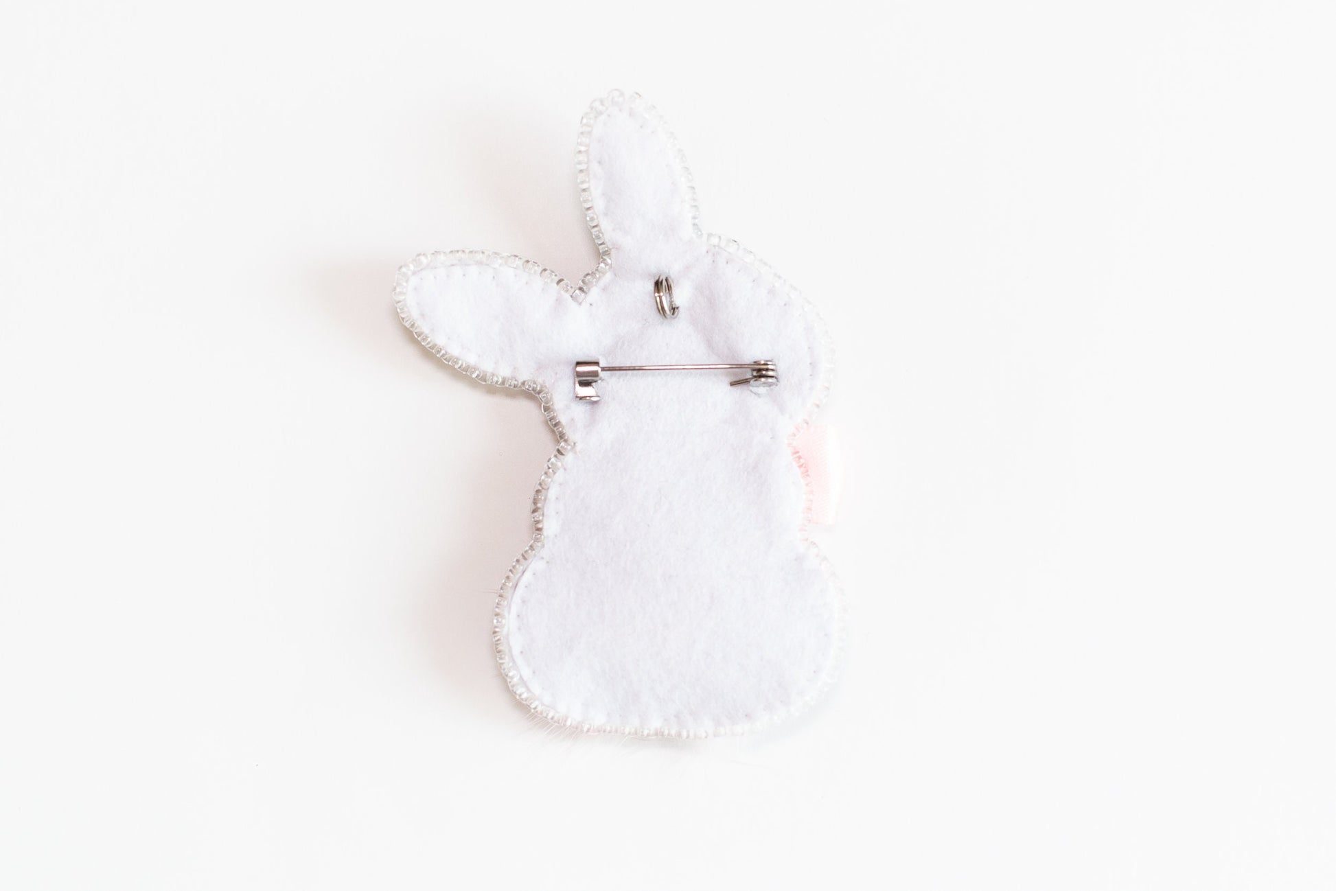 a white rabbit shaped object on a white surface