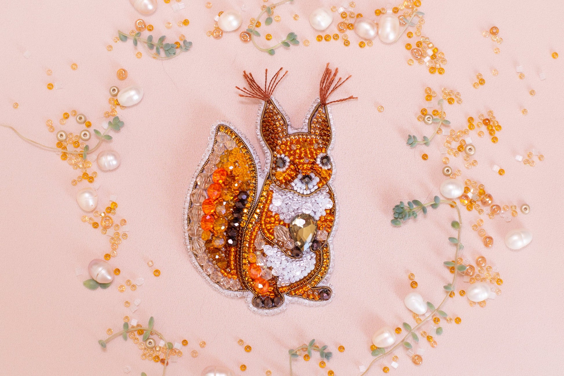 a picture of a squirrel made out of beads