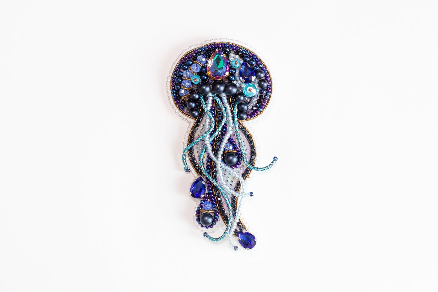 a brooch with a jellyfish design on it