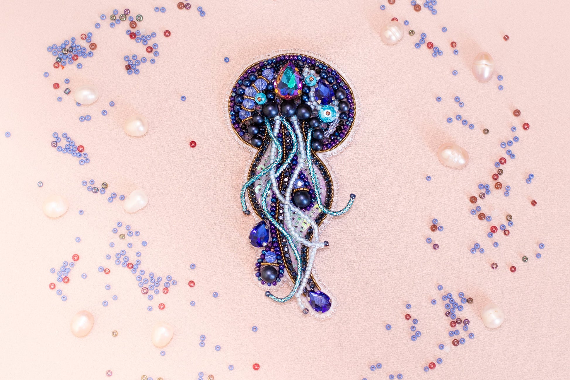 a brooch with a jellyfish design on it