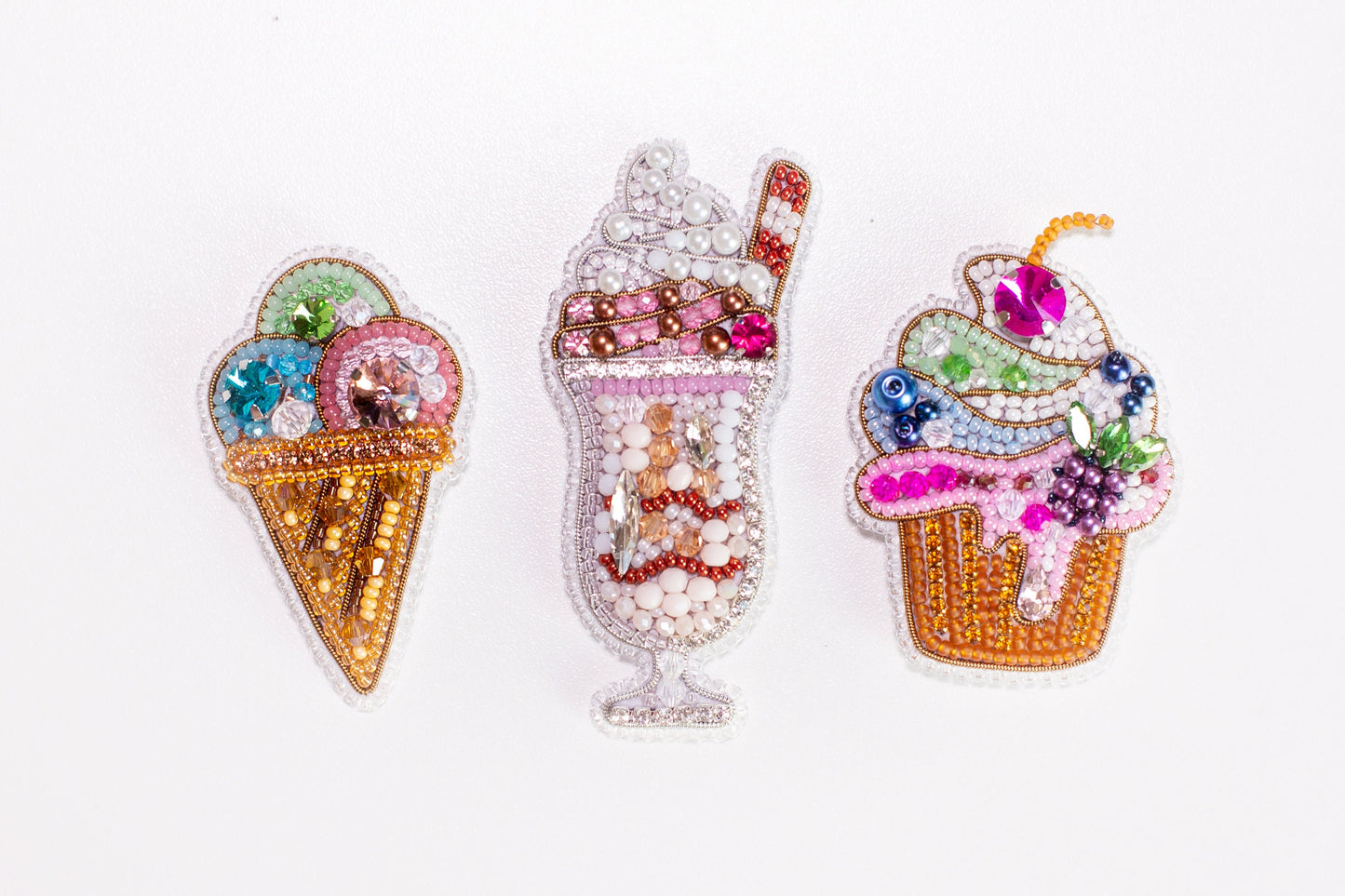 three different designs of ice cream on a white surface