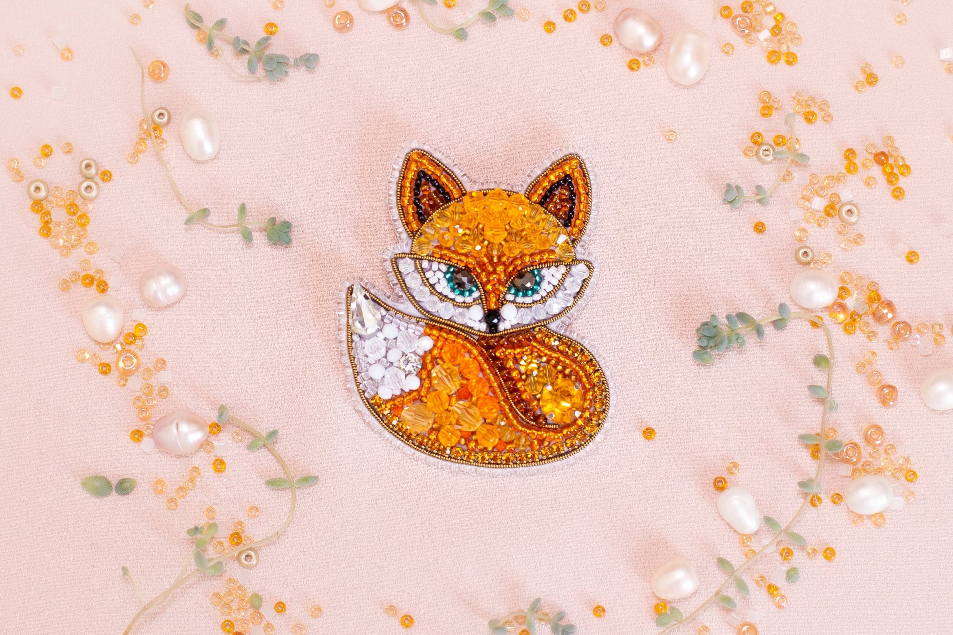 a brooch with a picture of a fox on it