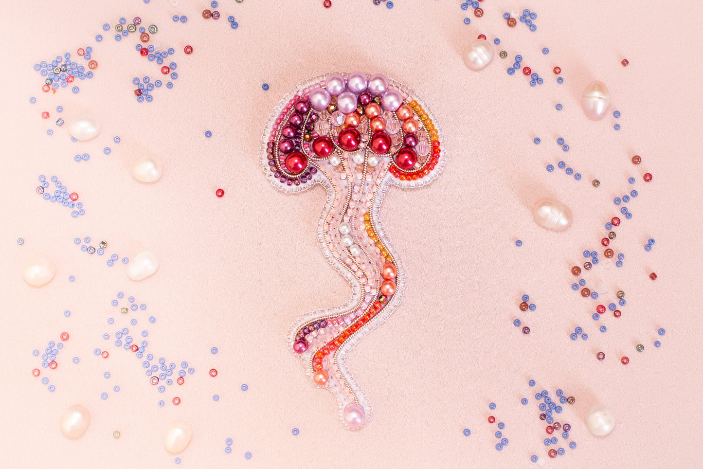 a brooch with a jellyfish design on it