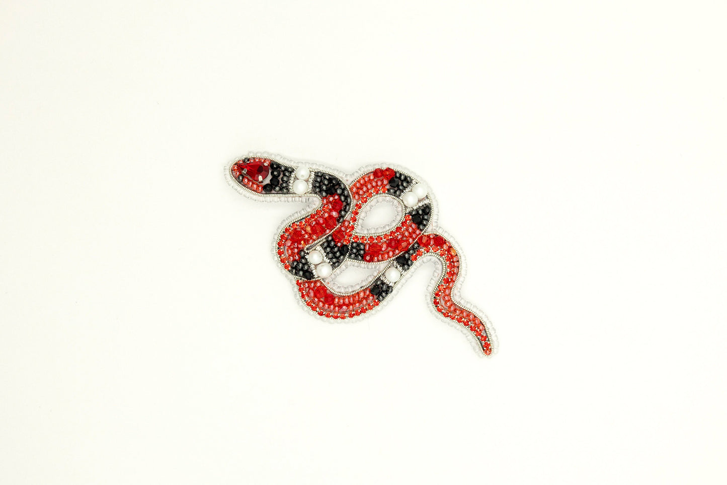 a red and black snake on a white background