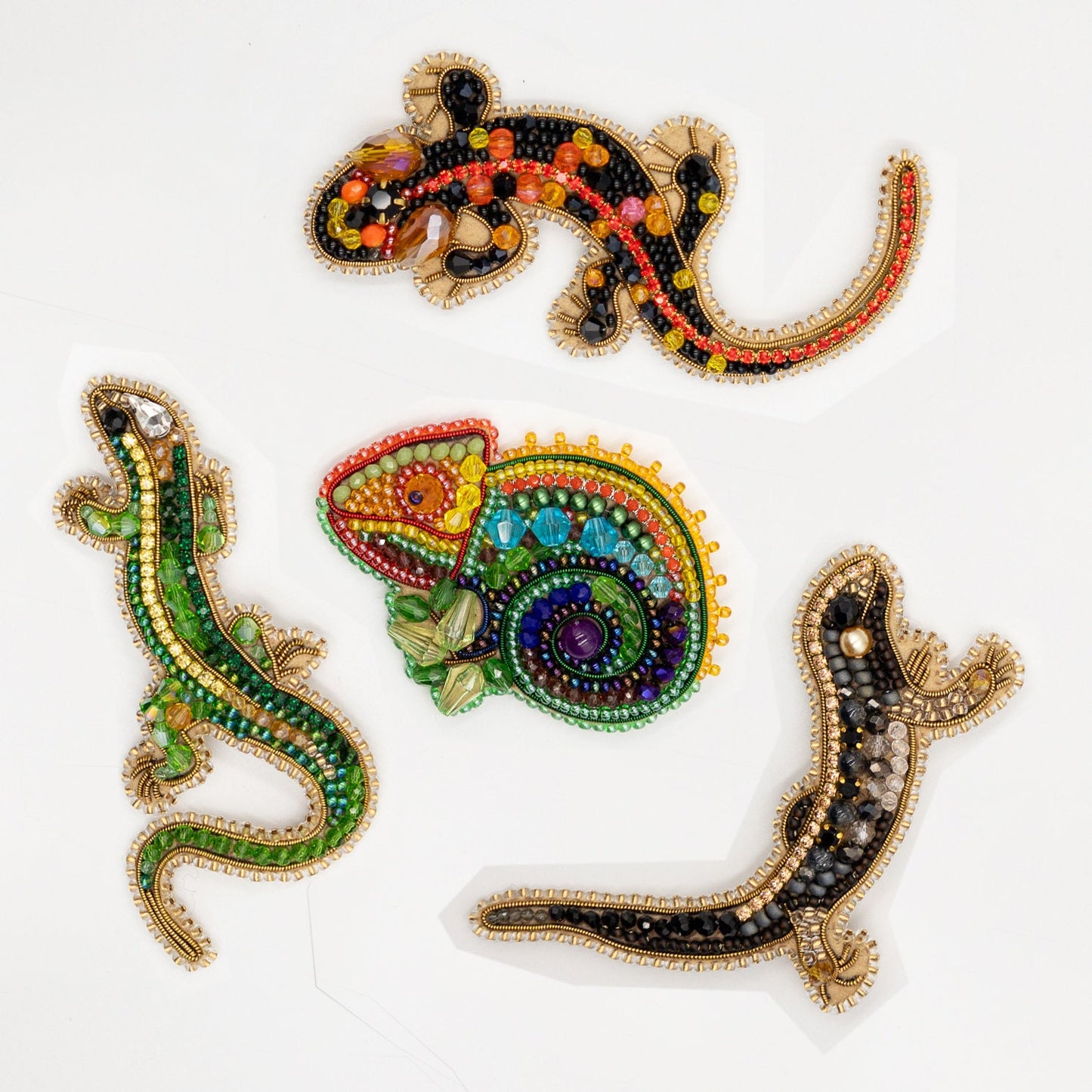 a group of beaded lizards sitting on top of a white table