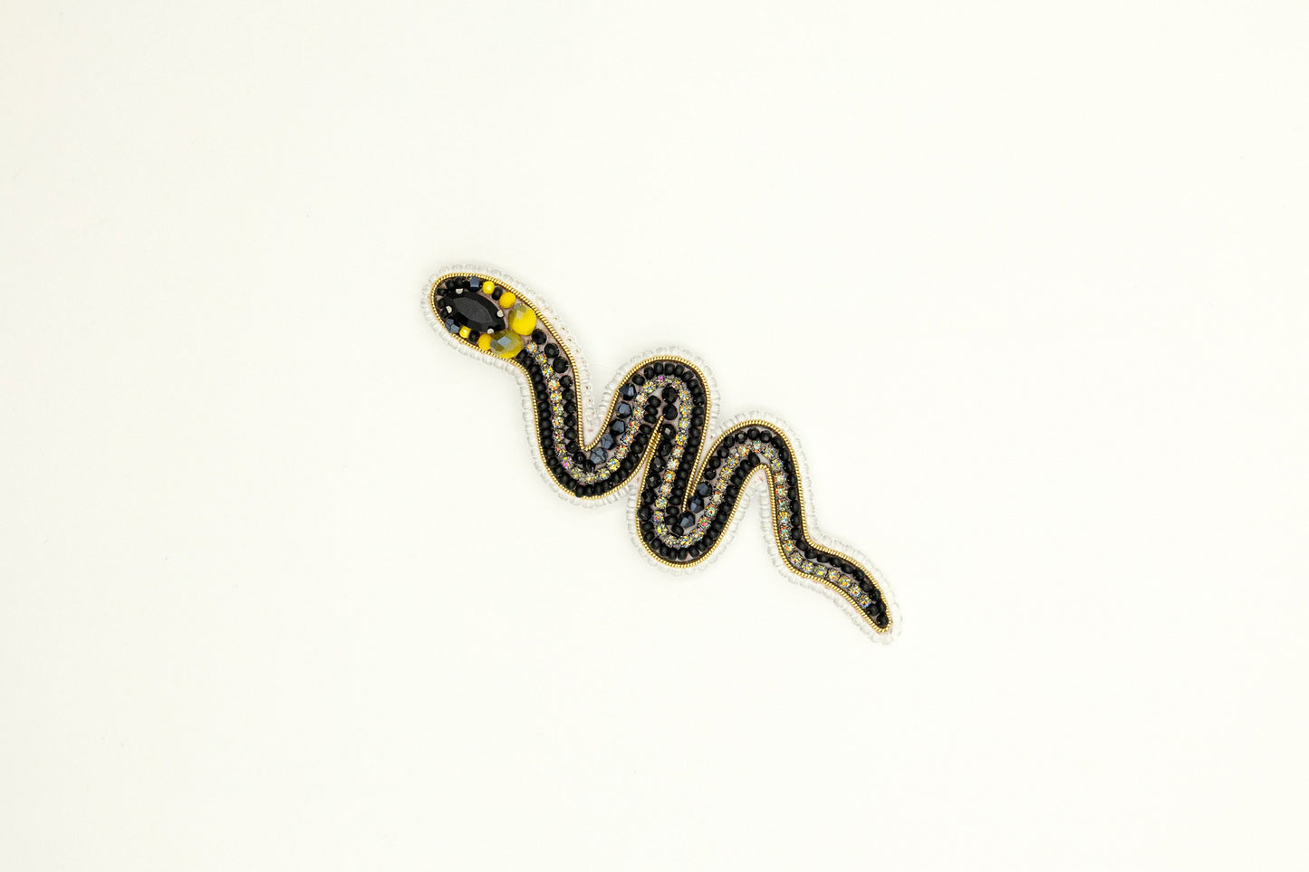 a black and yellow snake on a white background